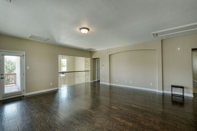 2937 Castellan Ln, Round Rock, TX 78665 - unfurnished room with attic access, healthy amount of natural light, wood finished floors, and a textured ceiling