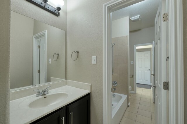 2937 Castellan Ln, Round Rock, TX 78665 - full bath with tile patterned floors, vanity, and shower / bath combination