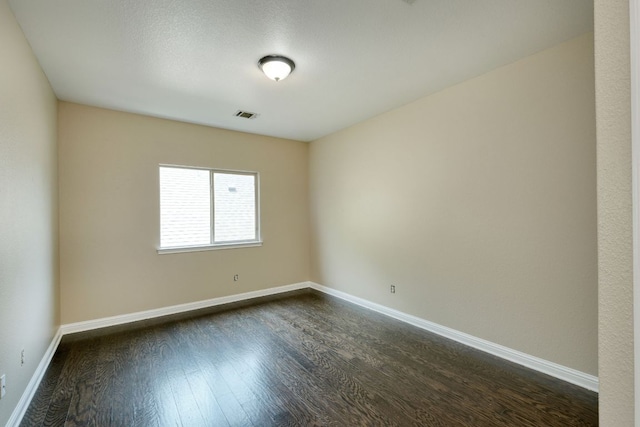 2937 Castellan Ln, Round Rock, TX 78665 - unfurnished room featuring dark wood-type flooring and baseboards