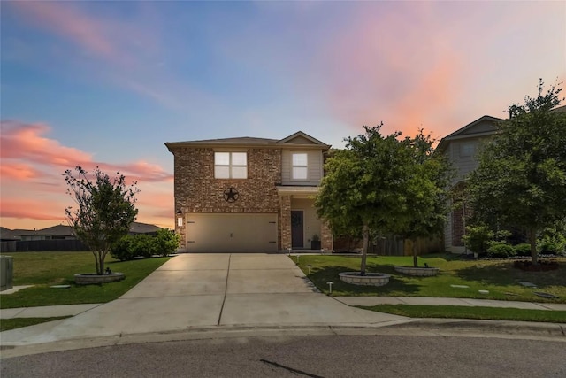 10901 Rome Ave, Austin, TX 78747 - view of front facade with concrete driveway, an attached garage, a lawn, and brick siding