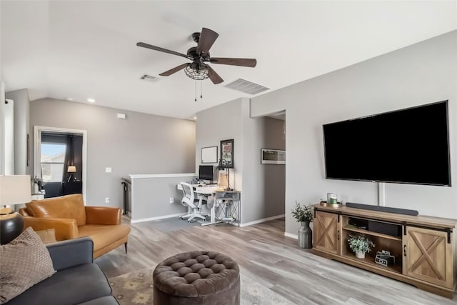 10901 Rome Ave, Austin, TX 78747 - living area with a ceiling fan, wood finished floors, a desk, an AC wall unit, and lofted ceiling