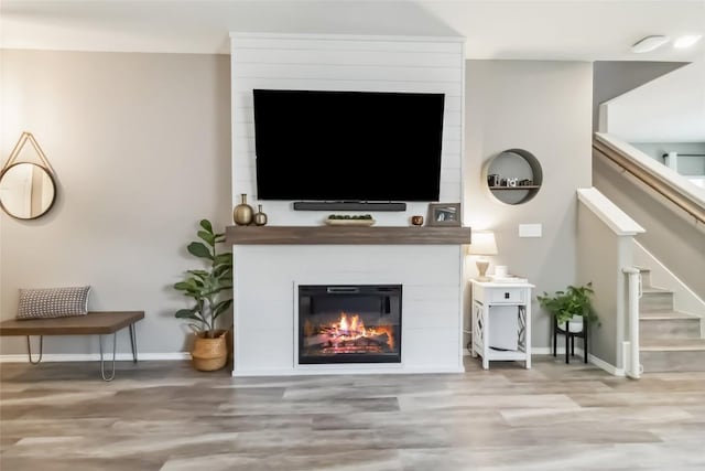 10901 Rome Ave, Austin, TX 78747 - living room with wood finished floors, stairs, and a fireplace