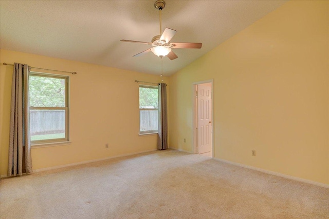 7925 Wheel Rim Cir, Austin, TX 78749 - empty room with a ceiling fan, light carpet, lofted ceiling, and baseboards