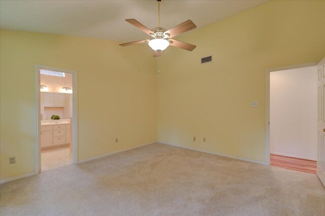 7925 Wheel Rim Cir, Austin, TX 78749 - spare room with light carpet, ceiling fan, and baseboards