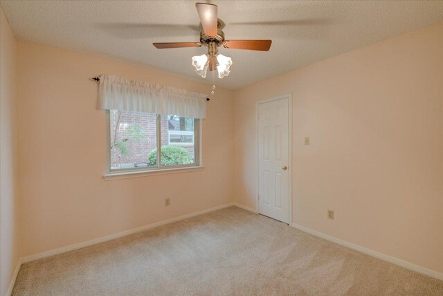 7925 Wheel Rim Cir, Austin, TX 78749 - carpeted spare room with a ceiling fan and baseboards