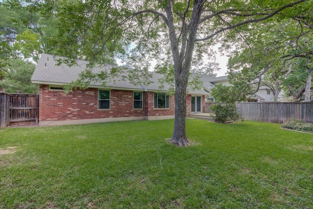 7925 Wheel Rim Cir, Austin, TX 78749 - back of property with brick siding and roof with shingles