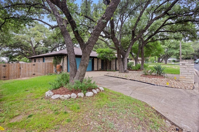 11505 Circle Bend Dr, Austin, TX 78758 - view of front facade with driveway and brick siding