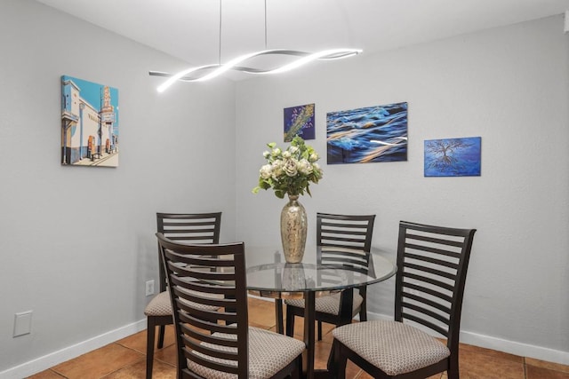 11505 Circle Bend Dr, Austin, TX 78758 - dining area featuring tile patterned floors and baseboards
