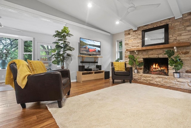 11505 Circle Bend Dr, Austin, TX 78758 - living area with a ceiling fan, a fireplace, wood finished floors, and baseboards