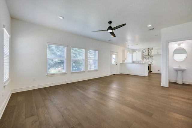 2105 Tiger Trl Unit 301, Round Rock, TX 78664 - unfurnished living room with ceiling fan, dark wood-style flooring, baseboards, and recessed lighting