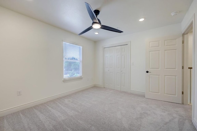 2105 Tiger Trl Unit 301, Round Rock, TX 78664 - unfurnished bedroom with light colored carpet, a closet, baseboards, recessed lighting, and a ceiling fan
