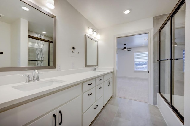 2105 Tiger Trl Unit 301, Round Rock, TX 78664 - bathroom with double vanity, ceiling fan, enclosed tub / shower combo, and tile patterned flooring