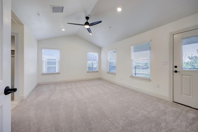 2105 Tiger Trl Unit 301, Round Rock, TX 78664 - empty room with light carpet, ceiling fan, vaulted ceiling, and baseboards