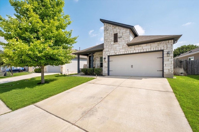 129 Lacey Oak Loop, San Marcos, TX 78666 - view of front of house with stone siding, driveway, and a garage