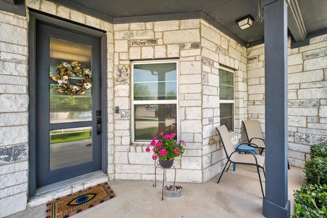 129 Lacey Oak Loop, San Marcos, TX 78666 - entrance to property featuring a porch and stone siding