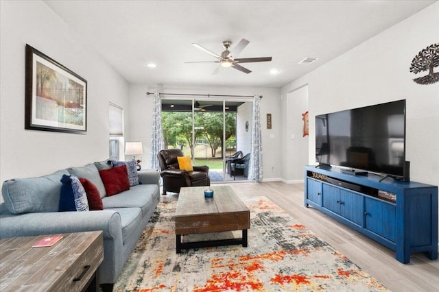 129 Lacey Oak Loop, San Marcos, TX 78666 - living area featuring light wood-type flooring, ceiling fan, recessed lighting, and baseboards