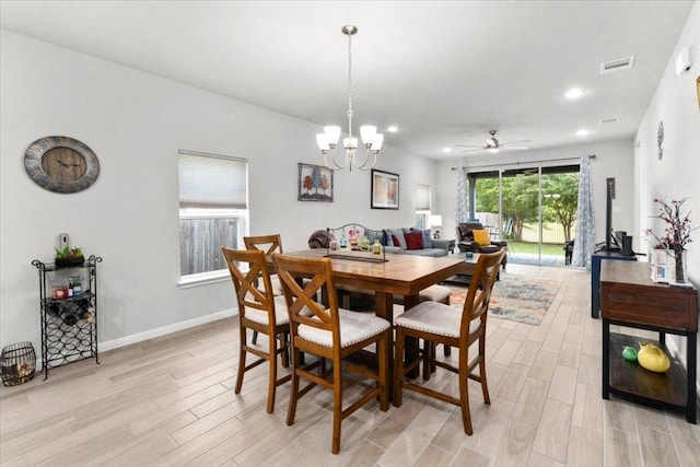 129 Lacey Oak Loop, San Marcos, TX 78666 - dining area featuring light wood finished floors, a chandelier, recessed lighting, a ceiling fan, and baseboards