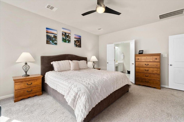 129 Lacey Oak Loop, San Marcos, TX 78666 - bedroom with carpet, baseboards, a ceiling fan, and ensuite bathroom