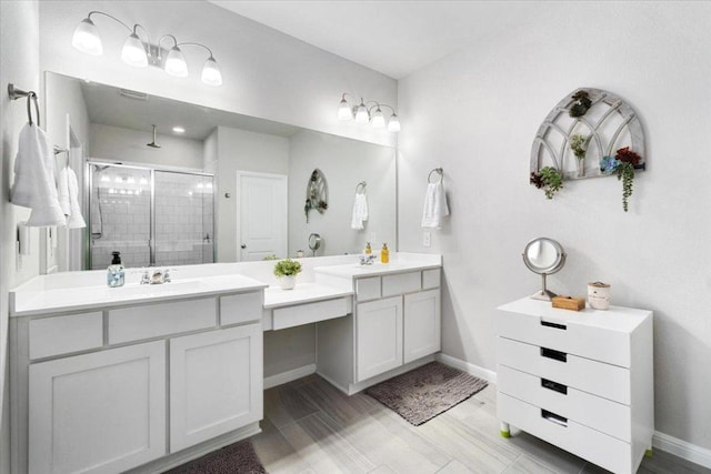 129 Lacey Oak Loop, San Marcos, TX 78666 - full bath featuring a shower stall, double vanity, and baseboards
