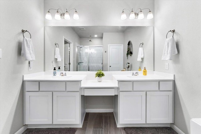 129 Lacey Oak Loop, San Marcos, TX 78666 - full bath featuring a shower stall, double vanity, and baseboards