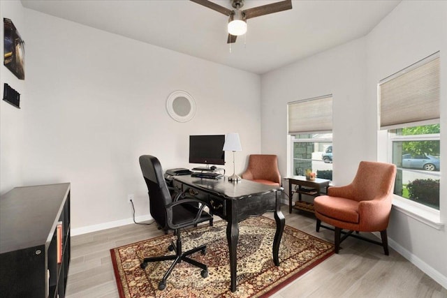 129 Lacey Oak Loop, San Marcos, TX 78666 - home office featuring ceiling fan, light wood-style flooring, and baseboards