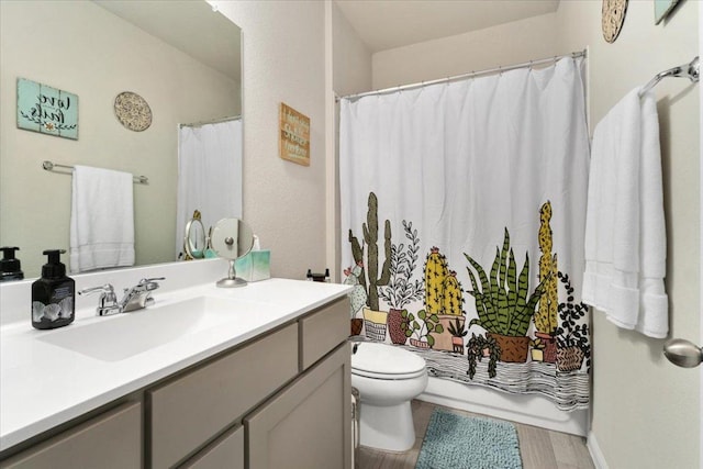 129 Lacey Oak Loop, San Marcos, TX 78666 - full bathroom featuring vanity, toilet, wood finished floors, and a shower with shower curtain