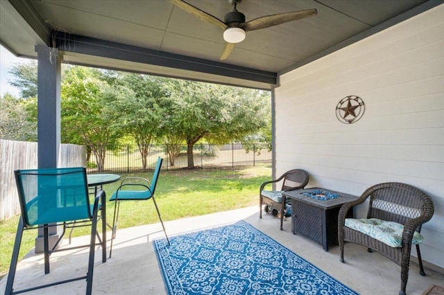 129 Lacey Oak Loop, San Marcos, TX 78666 - view of patio featuring ceiling fan, a fire pit, and outdoor dining space