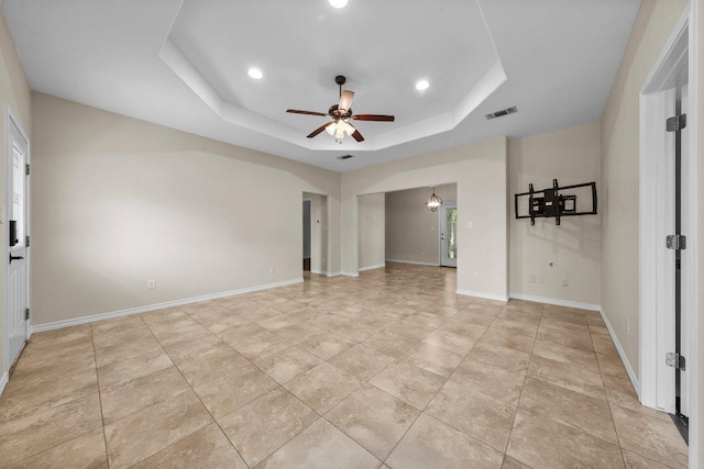 136 W Maple Dr, Granite Shoals, TX 78654 - unfurnished room with a tray ceiling, a ceiling fan, recessed lighting, and baseboards
