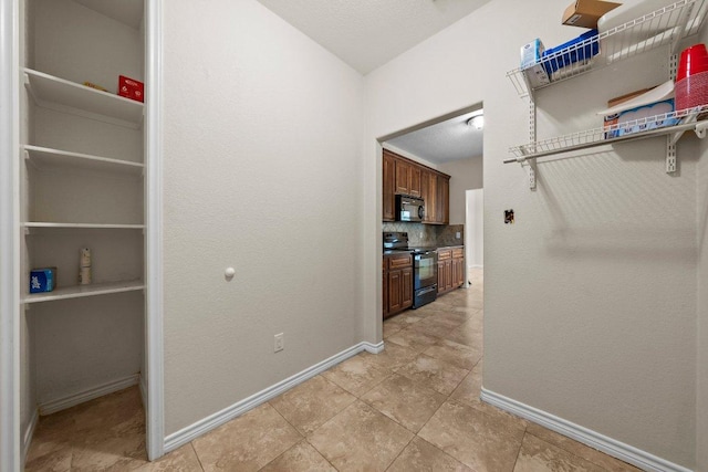 136 W Maple Dr, Granite Shoals, TX 78654 - spacious closet with light tile patterned flooring