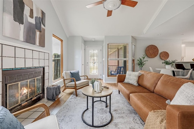 12319 Emery Oaks Rd, Austin, TX 78758 - living area featuring vaulted ceiling, wood finished floors, ceiling fan, and a fireplace