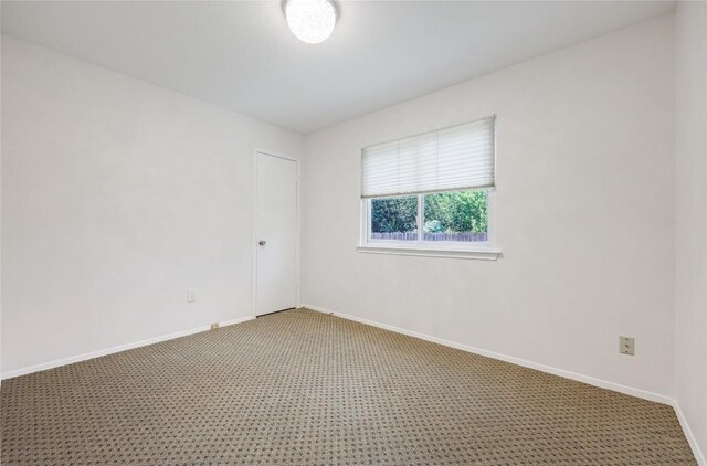 12319 Emery Oaks Rd, Austin, TX 78758 - empty room with light colored carpet and baseboards