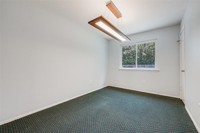 12319 Emery Oaks Rd, Austin, TX 78758 - unfurnished room with dark carpet and baseboards