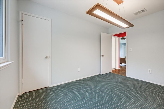 12319 Emery Oaks Rd, Austin, TX 78758 - unfurnished bedroom with carpet flooring and baseboards