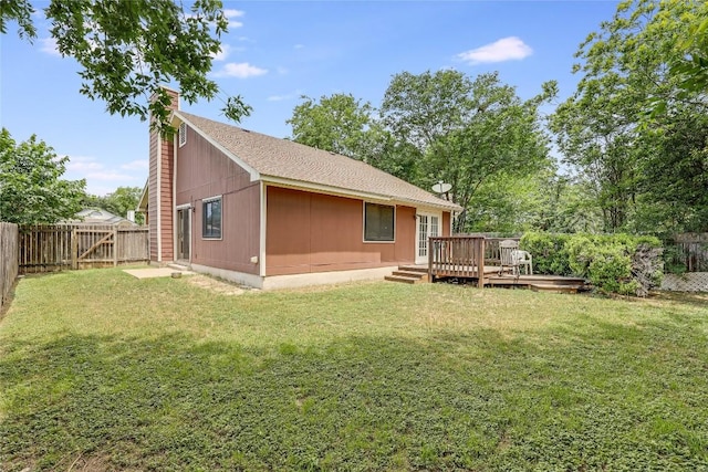 12319 Emery Oaks Rd, Austin, TX 78758 - rear view of house with a chimney, a fenced backyard, and a deck