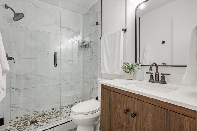 12319 Emery Oaks Rd, Austin, TX 78758 - bathroom featuring vanity and a marble finish shower
