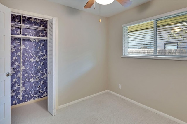 2905 Greenlawn Pkwy, Austin, TX 78757 - unfurnished bedroom featuring carpet, a closet, baseboards, and a ceiling fan