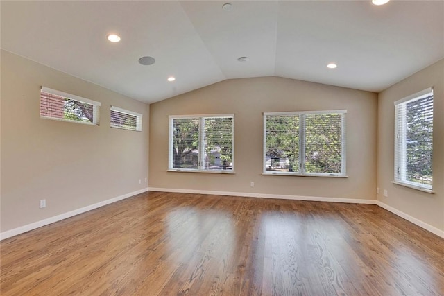 2905 Greenlawn Pkwy, Austin, TX 78757 - empty room featuring wood finished floors, lofted ceiling, baseboards, and recessed lighting