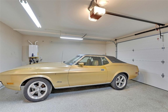 2905 Greenlawn Pkwy, Austin, TX 78757 - garage featuring tankless water heater and a garage door opener