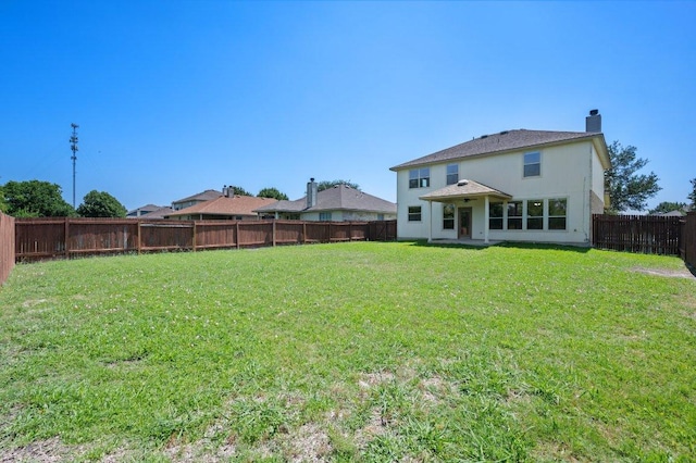 215 Gainer Dr, Hutto, TX 78634 - rear view of house featuring a chimney