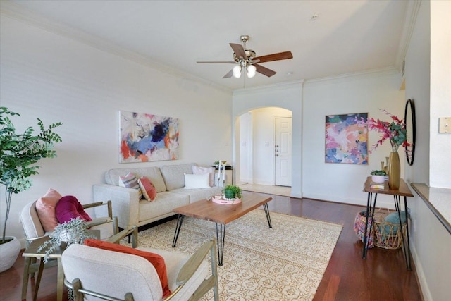 7701 Rialto Blvd Unit 1232, Austin, TX 78735 - living room featuring arched walkways, crown molding, wood finished floors, ceiling fan, and baseboards