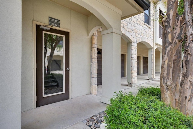 7701 Rialto Blvd Unit 1232, Austin, TX 78735 - view of exterior entry featuring stone siding and stucco siding