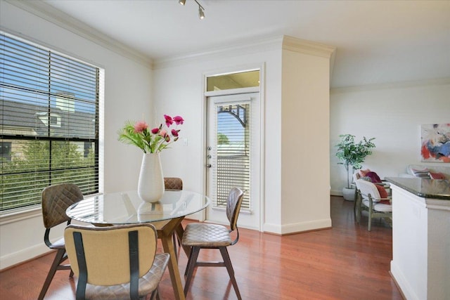 7701 Rialto Blvd Unit 1232, Austin, TX 78735 - dining room featuring wood finished floors, baseboards, and crown molding