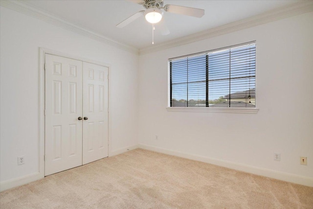 7701 Rialto Blvd Unit 1232, Austin, TX 78735 - unfurnished bedroom with carpet flooring, crown molding, baseboards, a closet, and a ceiling fan