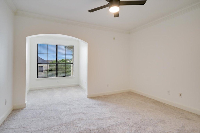 7701 Rialto Blvd Unit 1232, Austin, TX 78735 - empty room with light colored carpet, crown molding, ceiling fan, arched walkways, and baseboards