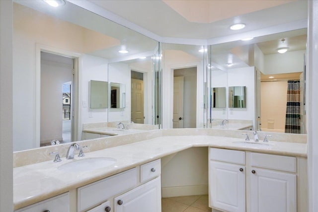 7701 Rialto Blvd Unit 1232, Austin, TX 78735 - bathroom featuring double vanity, tile patterned flooring, and recessed lighting