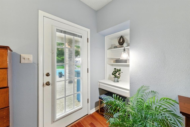10408 Cassia Dr, Austin, TX 78759 - doorway with wood finished floors