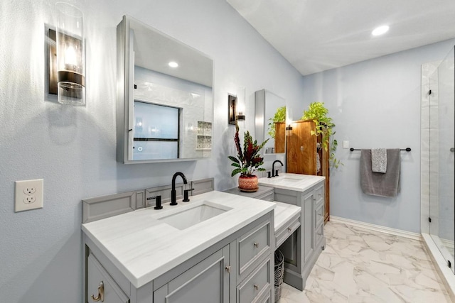 10408 Cassia Dr, Austin, TX 78759 - full bathroom with marble look tiles, two vanities, a stall shower, recessed lighting, and baseboards
