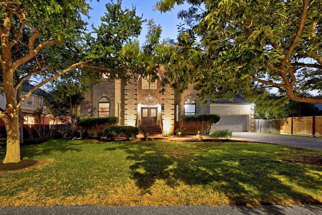10408 Cassia Dr, Austin, TX 78759 - view of front facade featuring asphalt driveway, a garage, and brick siding
