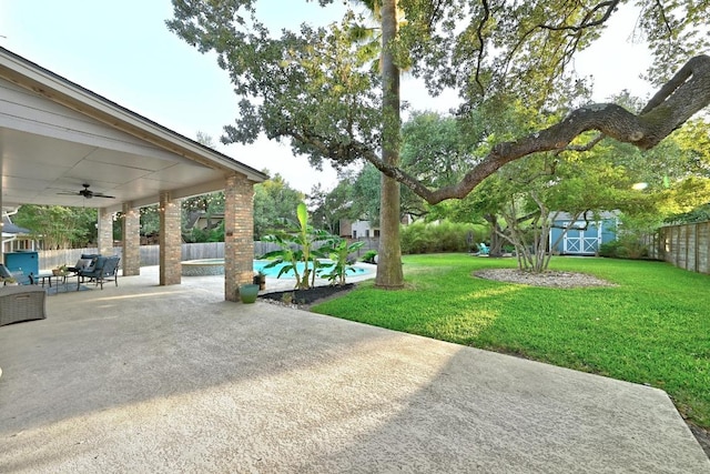 10408 Cassia Dr, Austin, TX 78759 - view of yard featuring a ceiling fan and a patio area