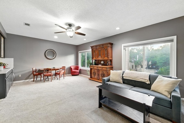 10408 Cassia Dr, Austin, TX 78759 - living room with a ceiling fan, light colored carpet, baseboards, a textured ceiling, and recessed lighting